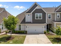Charming two-story home with a two-car garage and well-maintained landscaping at 450 Shale Creek Dr, Durham, NC 27703