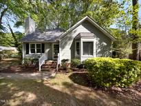 Charming single-story home with a well-manicured lawn, brick walkway, and inviting front entrance at 6005 Antigua, Knightdale, NC 27545