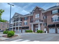 Elegant brick building with private garages and balconies offers sophisticated living at 800 Gathering Park Cir # 204, Cary, NC 27519