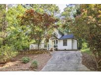 Charming home with a well-maintained yard and a beautiful stone retaining wall at 101 Creekview Cir, Carrboro, NC 27510