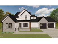Striking two-story home features a charming front porch and a two-car garage at 123-125 Ottawa Dr., Louisburg, NC 27549