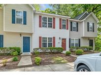 Charming townhouse exterior with colorful shutters and well-maintained landscaping at 2253 Violet Bluff Ct, Raleigh, NC 27610