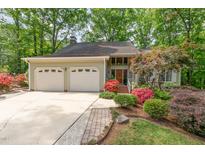 Charming home with two-car garage, beautifully landscaped yard, and mature trees at 53 Westridge Dr, Durham, NC 27713