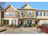 Charming townhouse featuring a well-maintained lawn and a classic exterior design in a suburban setting at 6323 Pesta Ct, Raleigh, NC 27612