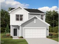 Charming two-story home with light gray siding, a white garage door, and a well-manicured front lawn at 813 Kenyon Spring Dr, Zebulon, NC 27597