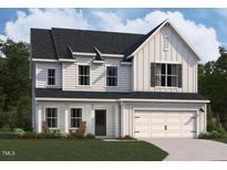Charming two-story home with a two-car garage, covered entry and well-manicured lawn and landscaping at 1401 Malcus Ct # 58, Fuquay Varina, NC 27526
