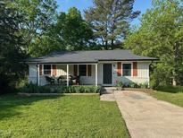 Charming single-story home features a covered porch, well-maintained lawn, and inviting curb appeal at 1708 Sundial Pl, Raleigh, NC 27610