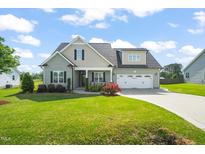 Charming home with a well-manicured lawn and inviting curb appeal at 60 Heart Pine Dr, Wendell, NC 27591