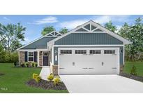 Charming single-story home with a two-car garage, well-manicured lawn, and appealing curb appeal at 70 Saintsbury Dr, Fuquay Varina, NC 27526