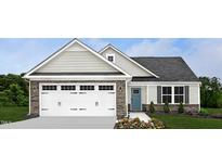 Charming home featuring a white garage door with stone accents and a welcoming blue front door with a landscaped front yard at 70 Saintsbury Dr, Fuquay Varina, NC 27526