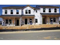 New construction townhomes featuring modern architecture and quality Tyvek HomeWrap for energy efficiency at 3712 Rosebush Dr, Zebulon, NC 27597