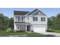 Charming two-story home featuring a grey color scheme, a two-car garage, and beautifully landscaped yard at 4304 Hunters Brook Run, Raleigh, NC 27616