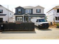 New construction home with mixed siding; construction van parked in front at 659 White Birch Ln, Angier, NC 27501