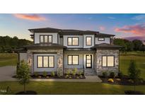 Stunning two-story home with stone accents, manicured lawn, and professional landscaping at 200 Broadleaf Ln, Youngsville, NC 27596