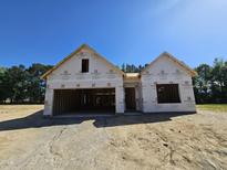 New home under construction featuring modern architectural design and spacious layout on a sunny day at 79 Mildred Dr, Broadway, NC 27505