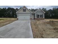 Charming single-Gathering home with a two-car garage and classic architectural details at 79 Mildred Dr, Broadway, NC 27505