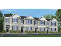 New construction townhomes feature a neutral color palette, stone accents, and an inviting entrance at 832 Old Tarboro Rd, Wendell, NC 27591