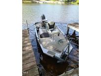 Docked Timemaker boat featuring grey carpet and chairs for a relaxing lake experience at 1605 Sagamore Dr, Louisburg, NC 27549