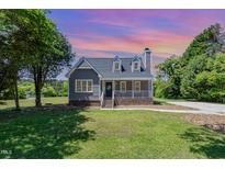 Charming single-Gathering home features a welcoming front porch and well-maintained lawn at 5337 Nc Hwy 96, Selma, NC 27576