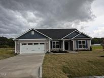 Charming single-story home with a two-car garage, landscaped yard, and inviting curb appeal at 1590 Pecan Drive # 45, Nashville, NC 27856