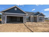 Newly constructed home with a two-car garage and a frame for a concrete driveway and walkway at 1590 Pecan Drive # 45, Nashville, NC 27856