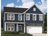 Charming two-story home with blue siding, stone accents, and white trim details at 215 Macon Lake Drive # 23, Apex, NC 27523
