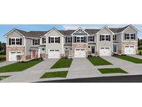 Charming townhomes featuring stone accents, private garages, and manicured landscaping offer an inviting curb appeal at 250 Elyse Overlook Loop, Sanford, NC 27332