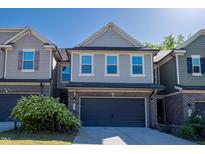 Charming two-story home with a two-car garage and attractive brick and siding exterior at 311 Alamosa Pl, Cary, NC 27519