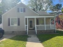 Charming single-story home with a welcoming front porch and well-maintained landscaping at 432 N Mercer N St, Rocky Mount, NC 27801