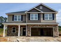 Two-story home featuring a stone facade, hardiplank siding, black shutters, and a two-car garage at 606 Melrose Ct, Sanford, NC 27330