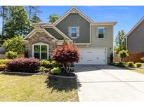 Charming two-story home featuring manicured landscaping and a two-car garage, offering curb appeal at 8840 Forester Ln, Apex, NC 27539