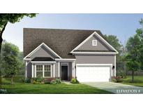 Charming single-Gathering home featuring a gray exterior, well-manicured lawn, and an attached garage at 1095 Channel Drop Lp, Zebulon, NC 27597
