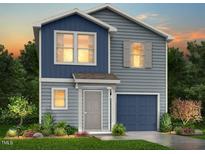 Charming two-story home with blue and gray siding and a well-maintained front yard at 124 Landon Pl, Roxboro, NC 27573