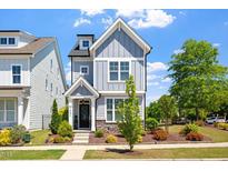 Charming two-story home featuring a welcoming front porch and beautifully landscaped yard at 1601 Glazebrook Dr, Wake Forest, NC 27587