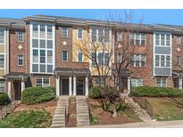 Charming multi-story townhomes with well-maintained landscaping and inviting front entrances at 235 Michigan Ave, Cary, NC 27519
