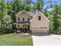 Beautiful two-story home with a welcoming front porch, attached two-car garage, and well-maintained landscaping at 3425 Donnigale Ave, Durham, NC 27705