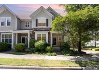 Charming two-story home with stone accents and lush landscaping at 4002 Cherry Blossom Cir, Durham, NC 27713