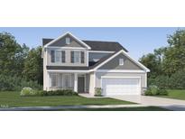 Inviting two-story home featuring a two-car garage, shuttered windows, and stone accents at 548 Morning Light Dr, Angier, NC 27501