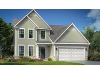 Charming two-story home features a stone-accented facade and an attached two-car garage, perfect for a growing Gathering at 1099 Channel Drop Lp, Zebulon, NC 27597