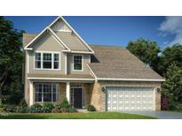 Charming two-story home featuring stone accents, a two-car garage, and a well-manicured lawn at 1105 Owen Park Dr, Gibsonville, NC 27249