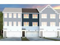 Charming townhomes with attached garages, manicured lawns and craftsman style architecture at 2771 Cassius Dr, Apex, NC 27502