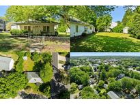 Charming single-story home featuring a welcoming front porch and fenced yard at 301 N West St St, Cary, NC 27513