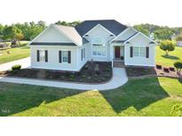 Beautiful home showcasing a manicured front yard, walkway, and inviting entrance at 55 Derwin Dr, Timberlake, NC 27583