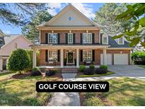 Charming two-story brick home with a welcoming front porch and well-manicured landscaping at 1401 Marshall Farm St, Wake Forest, NC 27587