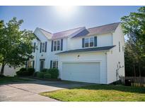 Charming two-story home boasts a two-car garage and well-maintained landscaping at 1909 Redding Lane, Durham, NC 27712