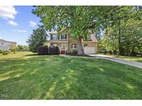 Charming home with a large front yard, mature tree, and a two car garage at 210 Mediate Dr, Raleigh, NC 27603