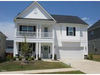 Charming two-story home with a covered porch and well-maintained lawn at 222 Oak Branch Trl, Garner, NC 27529