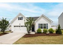 Charming single-story home with white siding, a two-car garage, and well-manicured landscaping at 321 Everly Mist Way, Wake Forest, NC 27587