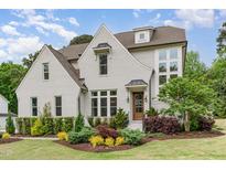 Charming painted-brick home featuring professionally landscaped lawn and a welcoming front entrance at 46 Bonterra Way, Chapel Hill, NC 27516