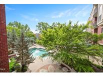 Refreshing community pool surrounded by mature trees offers a relaxing outdoor space at 618 N Boylan Ave # 622, Raleigh, NC 27603